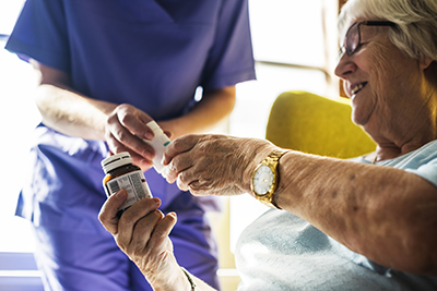 Patient receiving medications from nurse